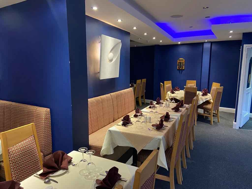 Warm Indian restaurant interior ready for dinner service